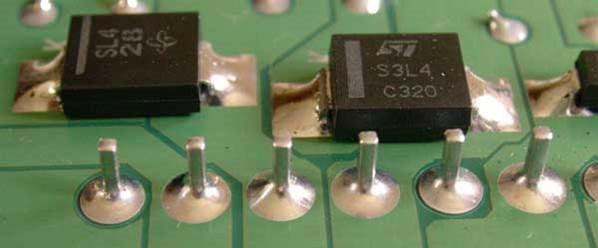 SMT and through hole components on a PCB after soldering with tin-lead solder alloy.