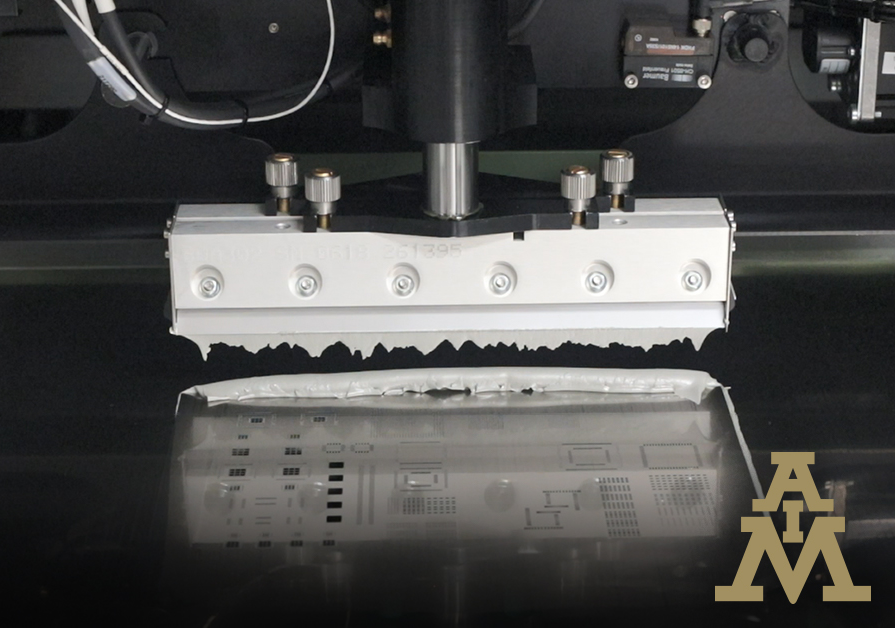 Solder paste being applied via squeegee